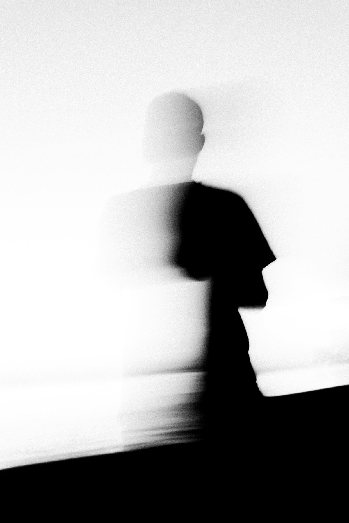 Black silhouette of a person against a white background