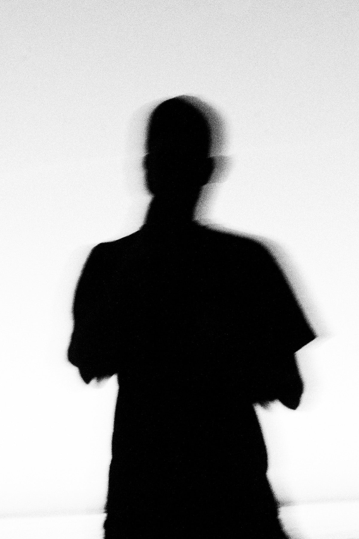 Black silhouette of a person against a white background